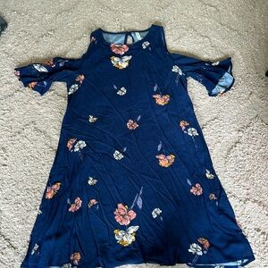 Navy blue short length dress with off the shoulder cap sleeves.